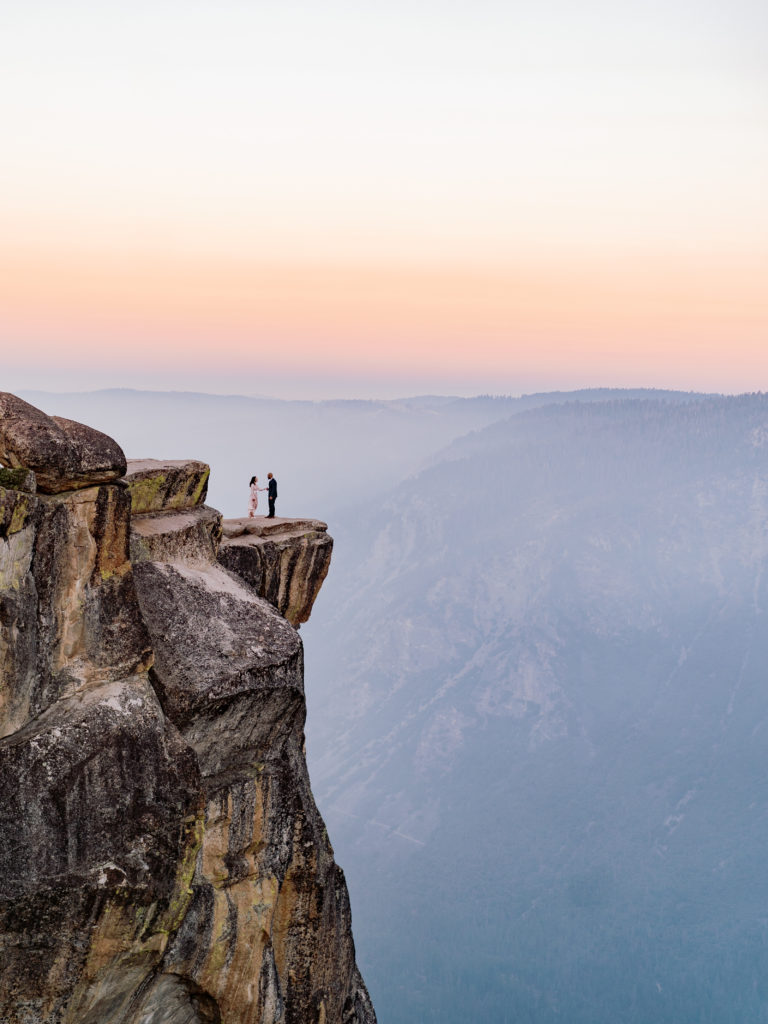 Yosemite elopement portrait on a cliff at sunset
