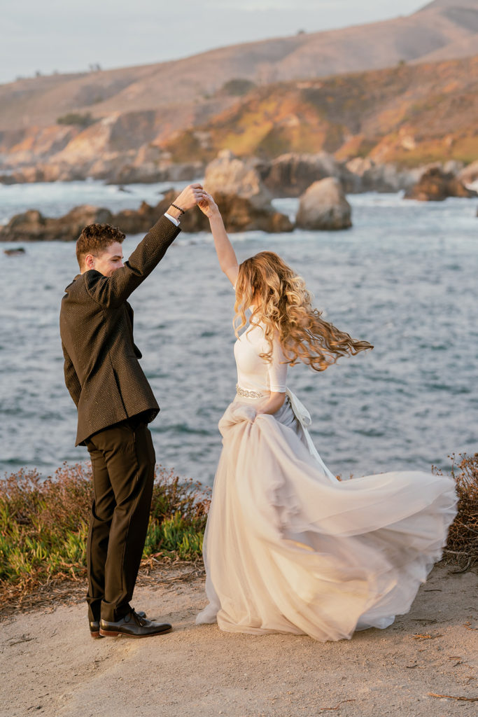 Big Sur Elopement - groom twirls bride