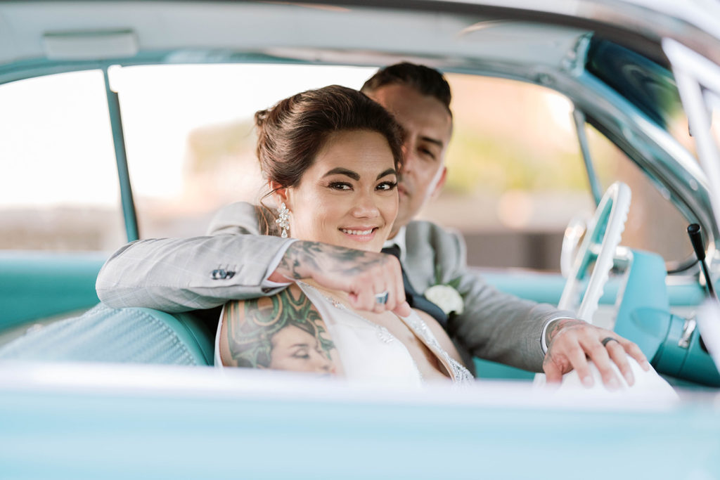 A Callaway Winery Spring Wedding with Bride and Groom in a Classic Chevy Impala
